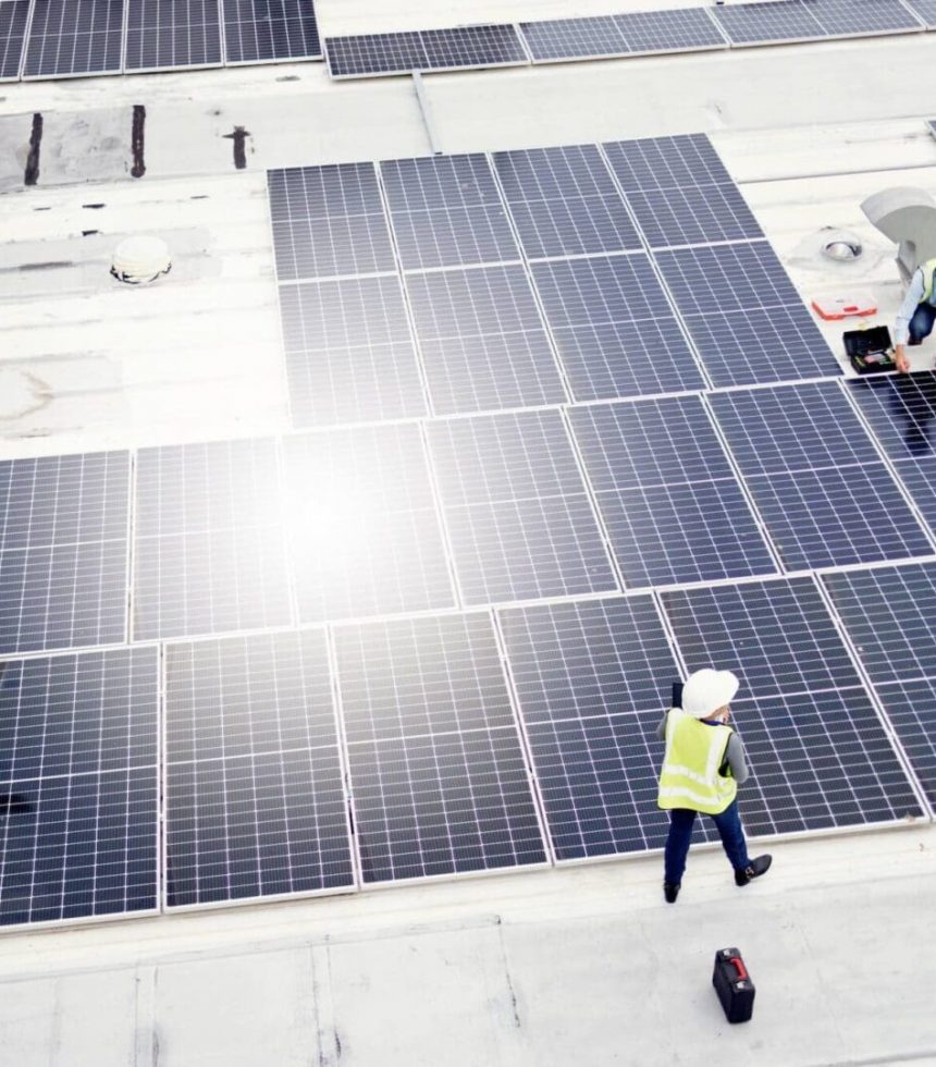 Solar energy, construction and employees building solar panels in collaboration for sustainability,.